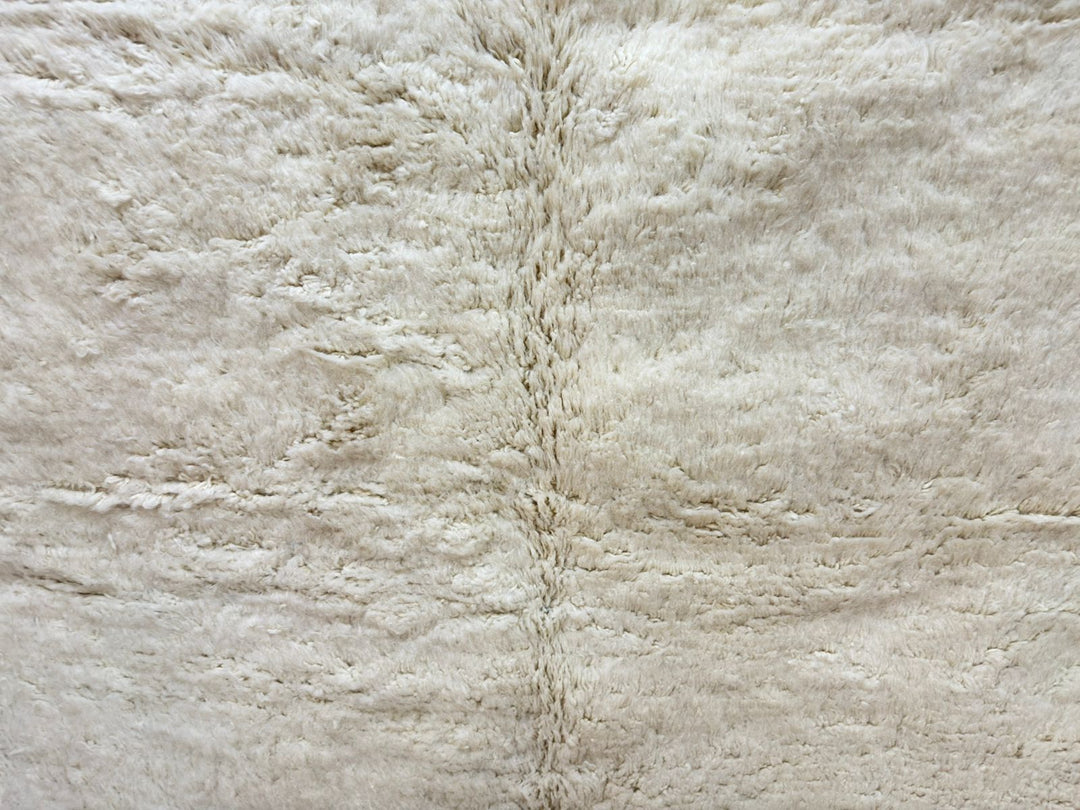 Close-up of a textured beige fabric surface