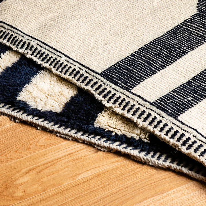 Abstract Black and White Beni Mrirt Moroccan Wool Rug with geometric pattern, handwoven from authentic Moroccan wool.