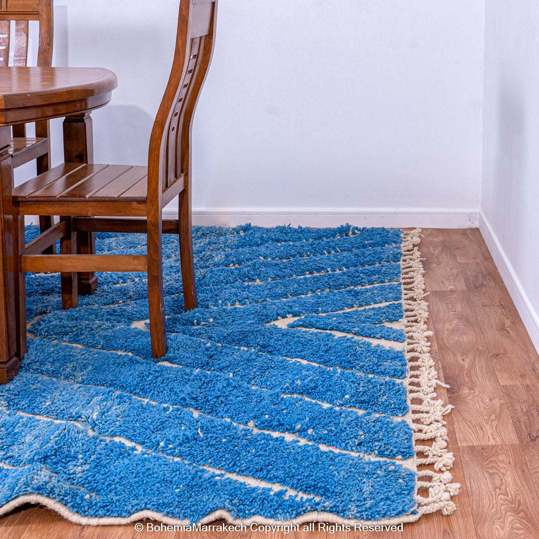 Multicolored Moroccan Boujaad Rug handmade with wool, featuring vibrant pink, yellow, and blue Berber patterns.