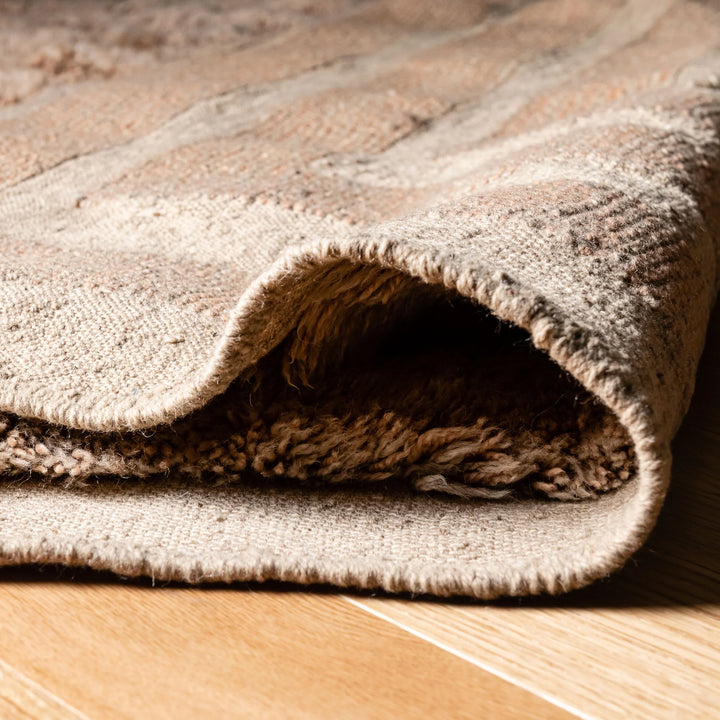 Close-up of Beige Beni Mrirt handwoven Moroccan wool rug with high-pile and modern design, showcasing texture and craftsmanship.
