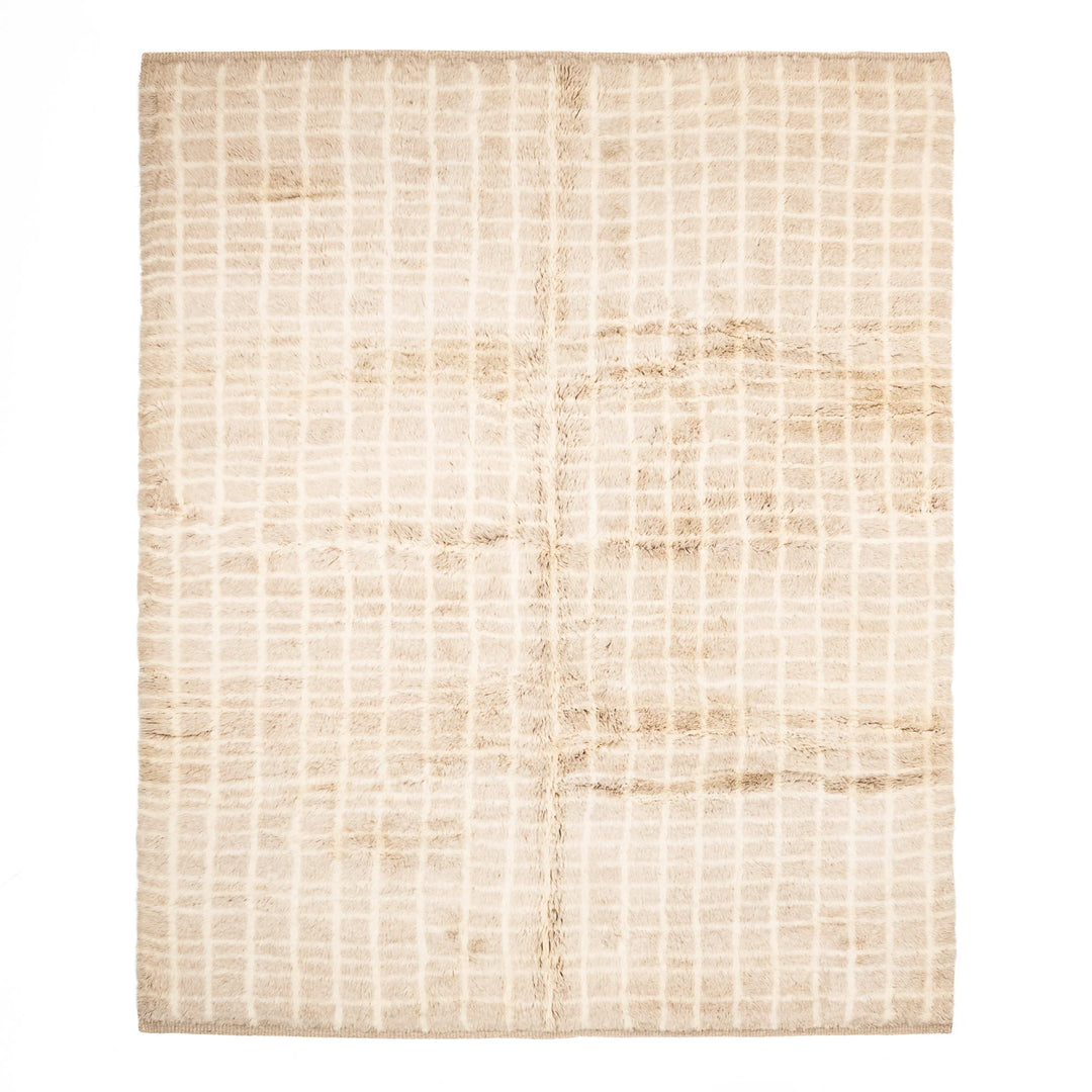 Beige Moroccan wool rug with a subtle grid pattern, perfect for minimalist or Scandinavian decor, handmade by Berber artisans.