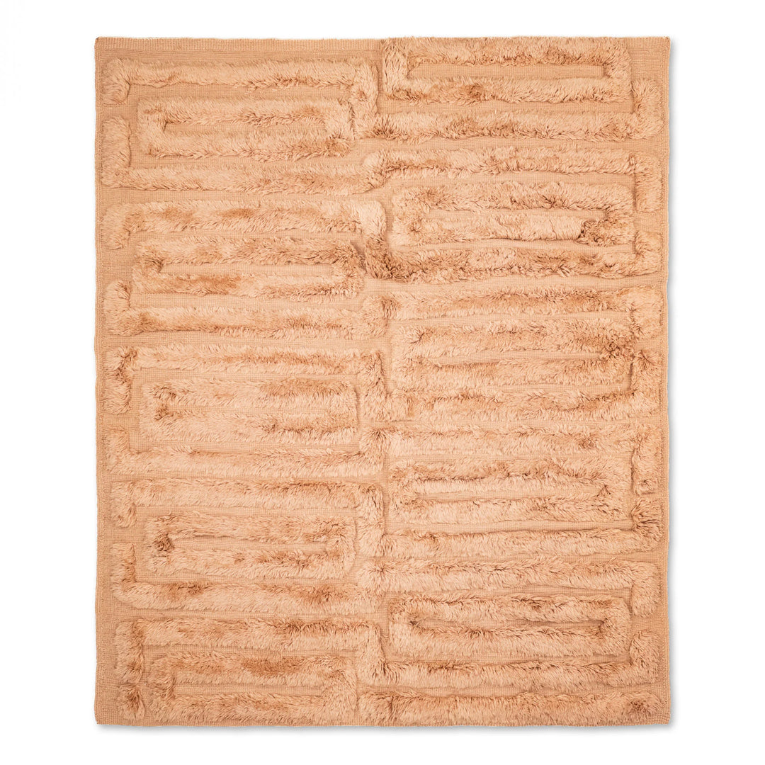 Handmade Moroccan wool rug in abstract design, featuring shades of pink, teal, and ochre, perfect for cozy living spaces.