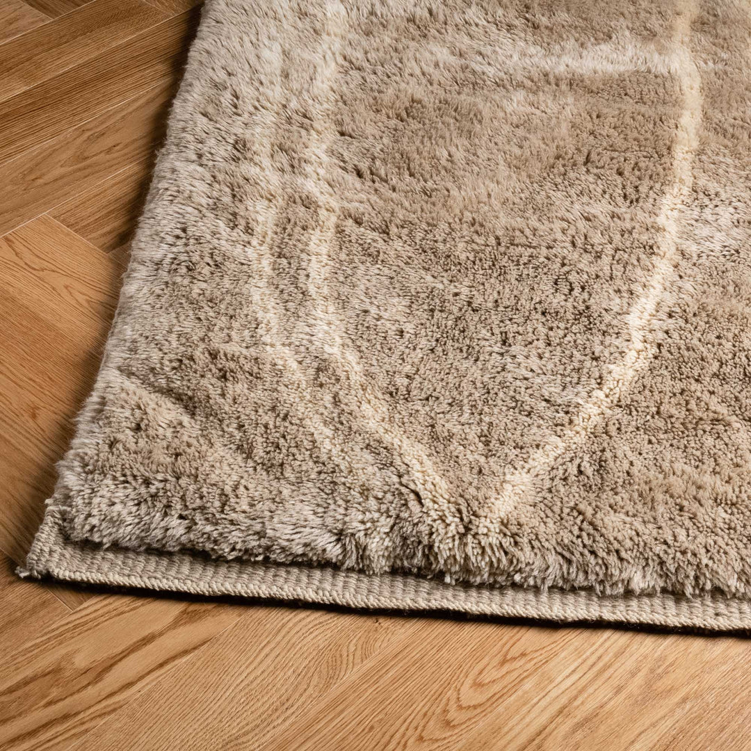 Beige Wool Beni Ourain Moroccan Rug with Soft Berber Design on Hardwood Floor