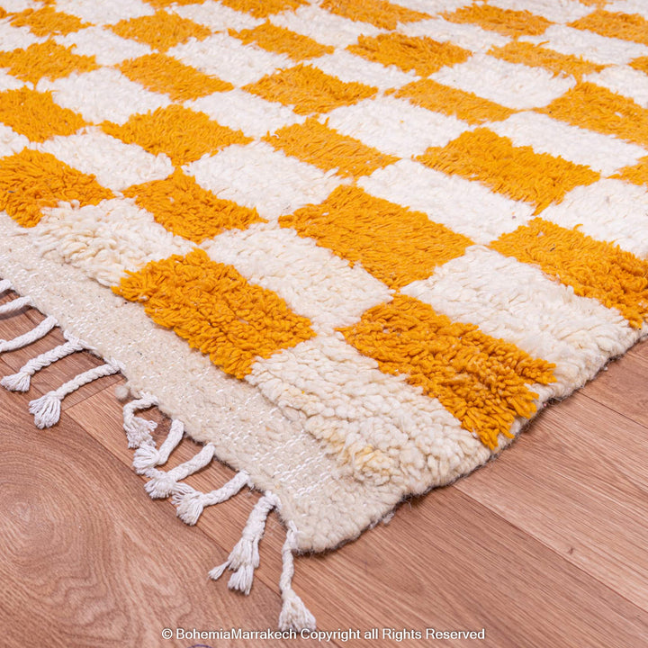 Handmade Moroccan rug with orange and white checkerboard pattern – wool area rug