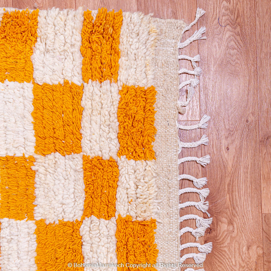 Handmade Moroccan rug with orange and white checkerboard pattern – wool area rug