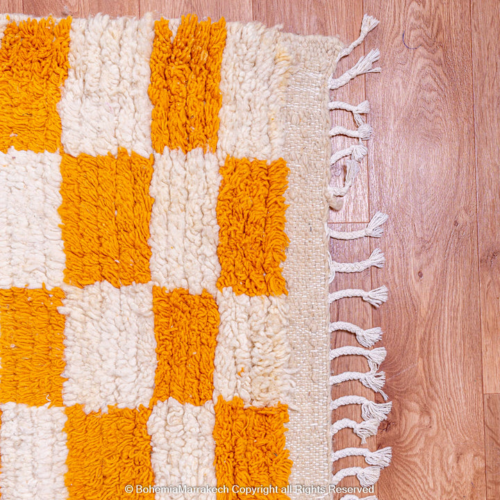 Handmade Moroccan rug with orange and white checkerboard pattern – wool area rug