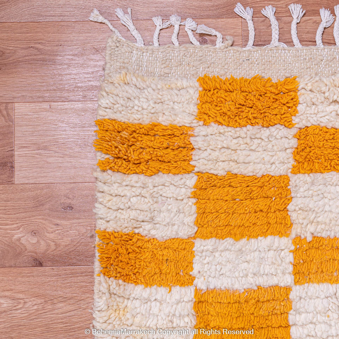 Handmade Moroccan rug with orange and white checkerboard pattern – wool area rug