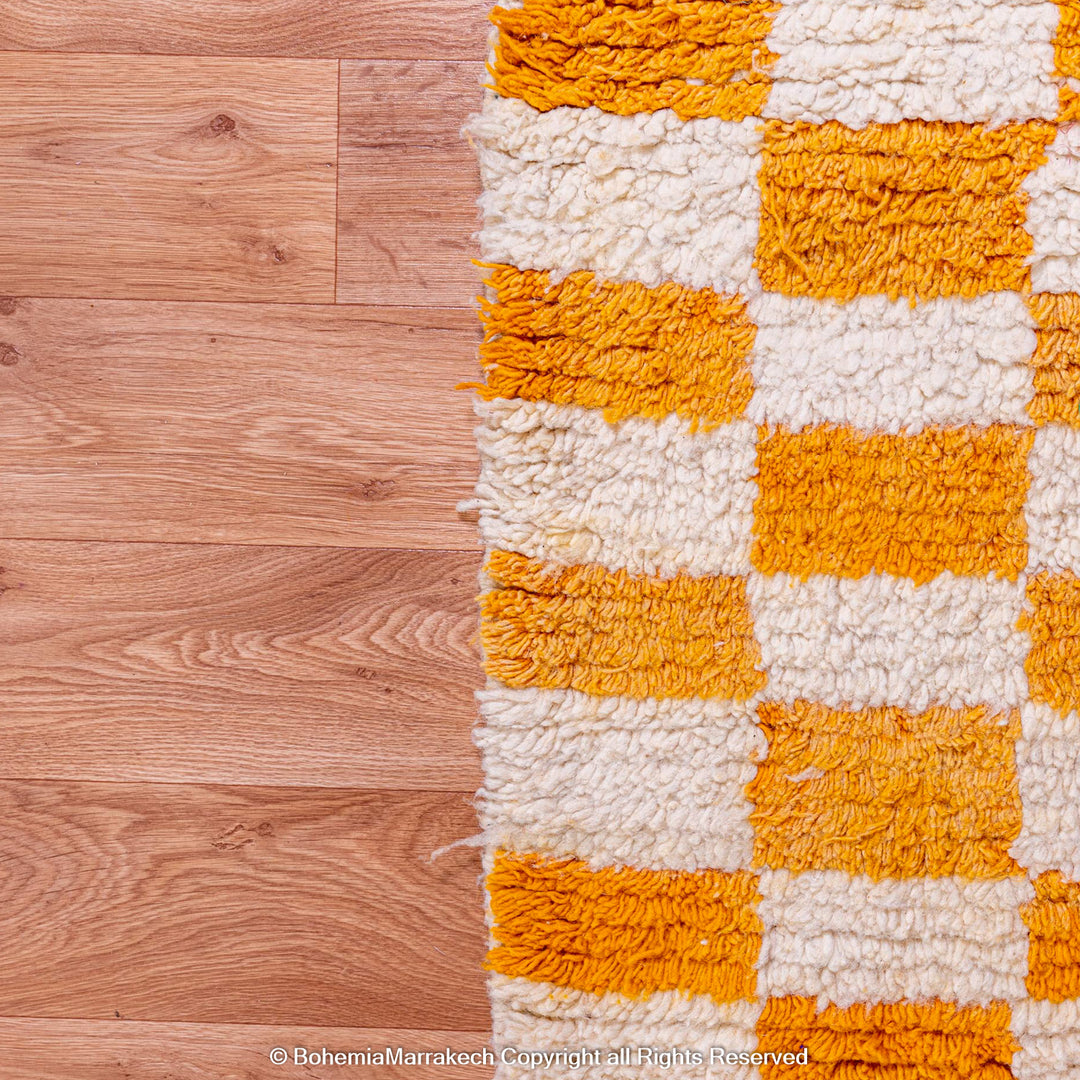 Handmade Moroccan rug with orange and white checkerboard pattern – wool area rug