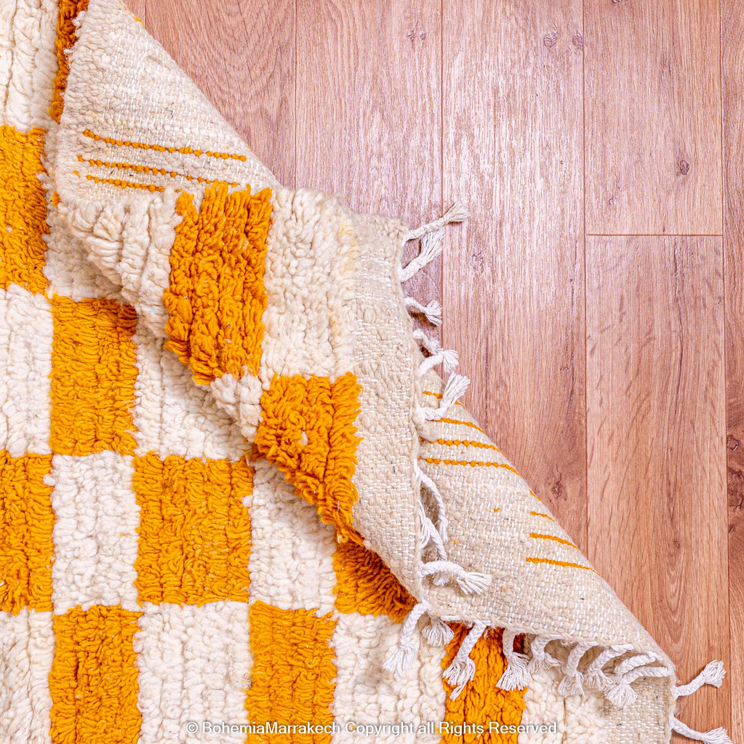 Handmade Moroccan rug with orange and white checkerboard pattern – wool area rug