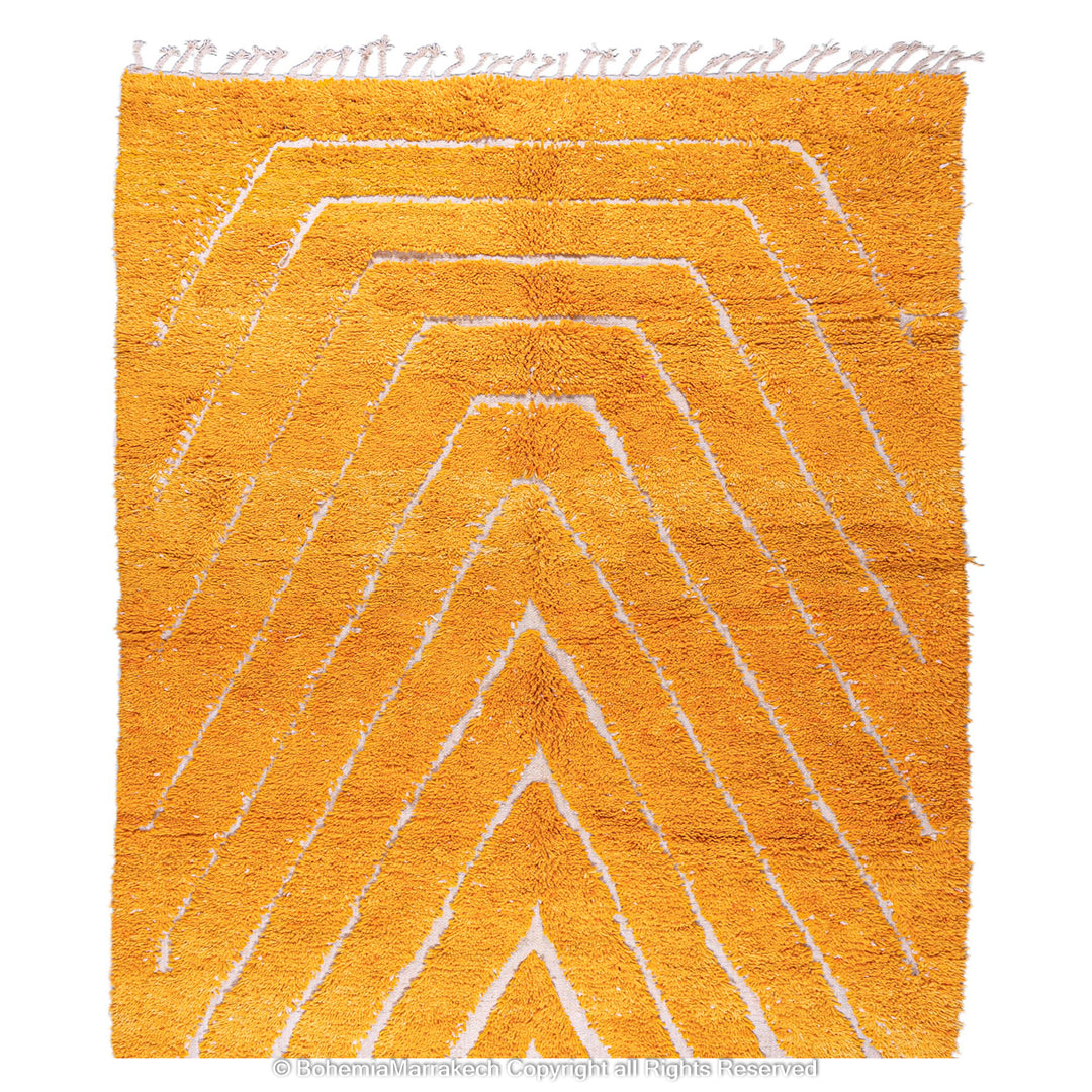 Orange Moroccan wool rug with chevron pattern and shag texture