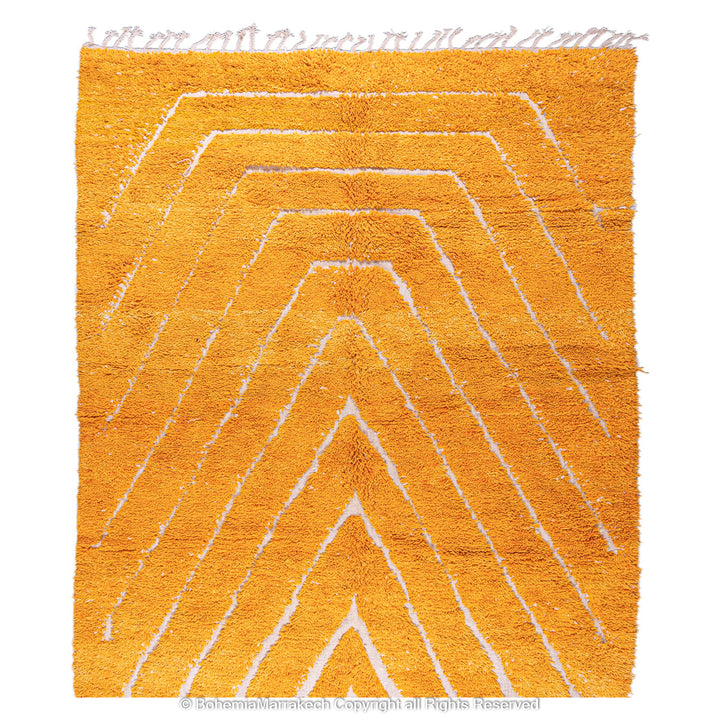 Orange Moroccan wool rug with chevron pattern and shag texture
