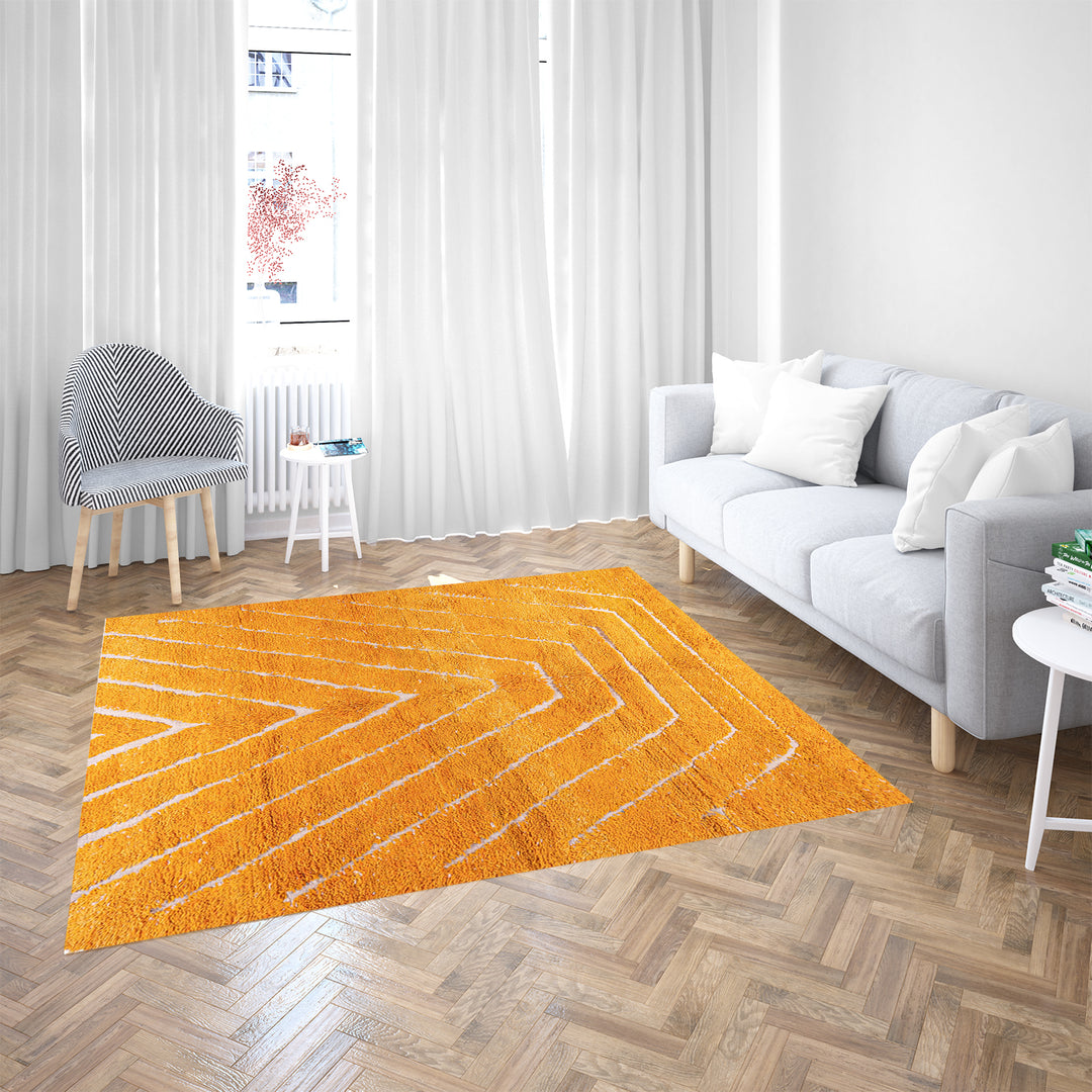 Orange Moroccan wool rug with chevron pattern and shag texture