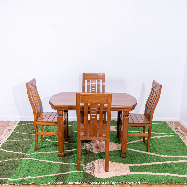 Green Moroccan rug with pink abstract desert motif design, handmade in wool