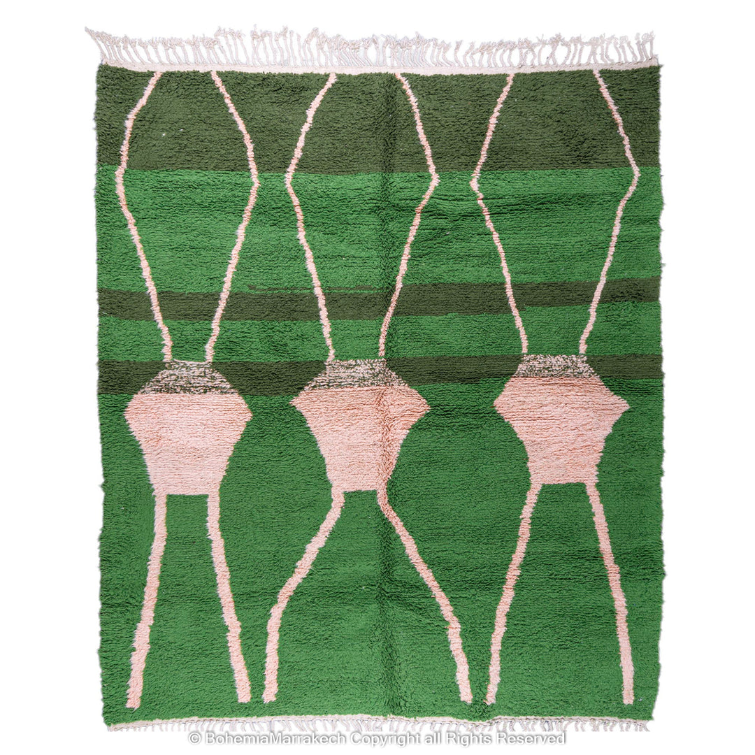 Green Moroccan rug with pink abstract desert motif design, handmade in wool