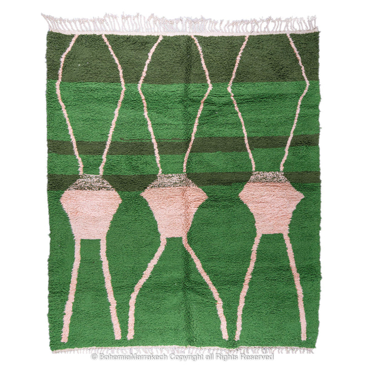 Green Moroccan rug with pink abstract desert motif design, handmade in wool