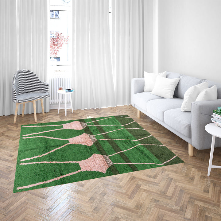 Green Moroccan rug with pink abstract desert motif design, handmade in wool