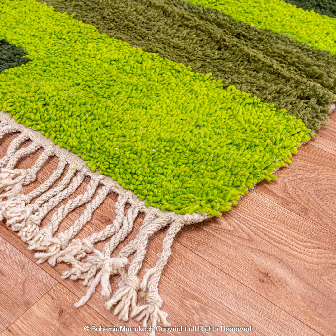 Handmade green geometric Moroccan wool rug with modern pattern