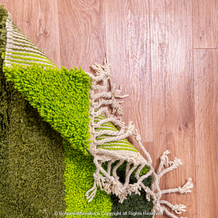 Handmade green geometric Moroccan wool rug with modern pattern