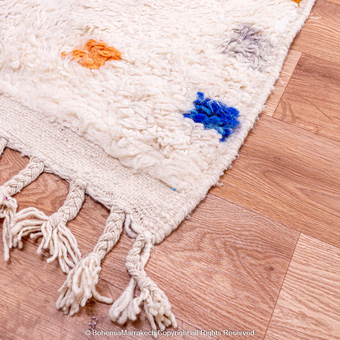 Minimalist Moroccan wool rug with tribal Berber design in natural tones