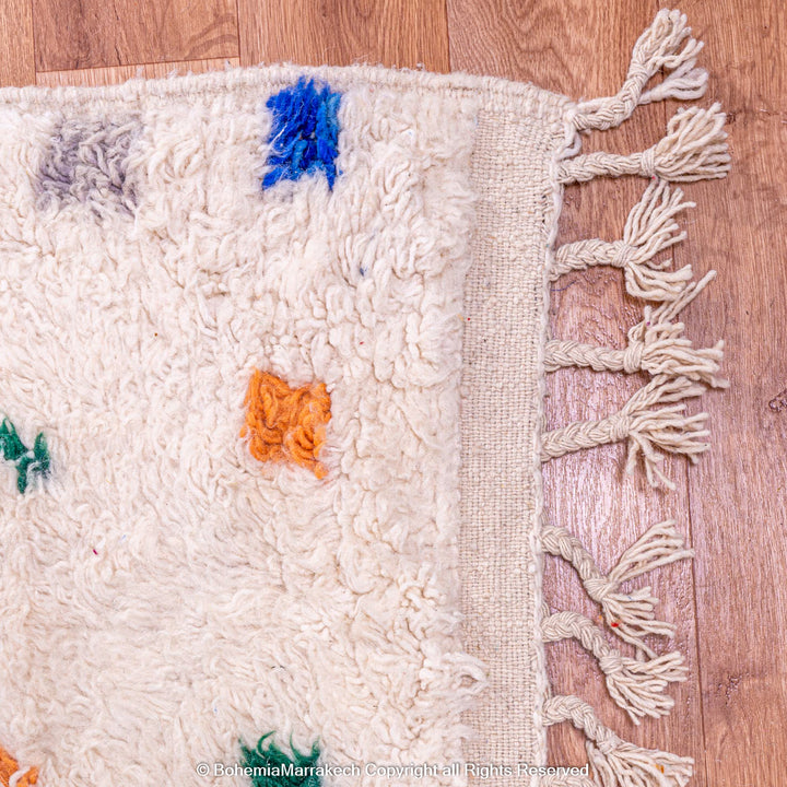Minimalist Moroccan wool rug with tribal Berber design in natural tones