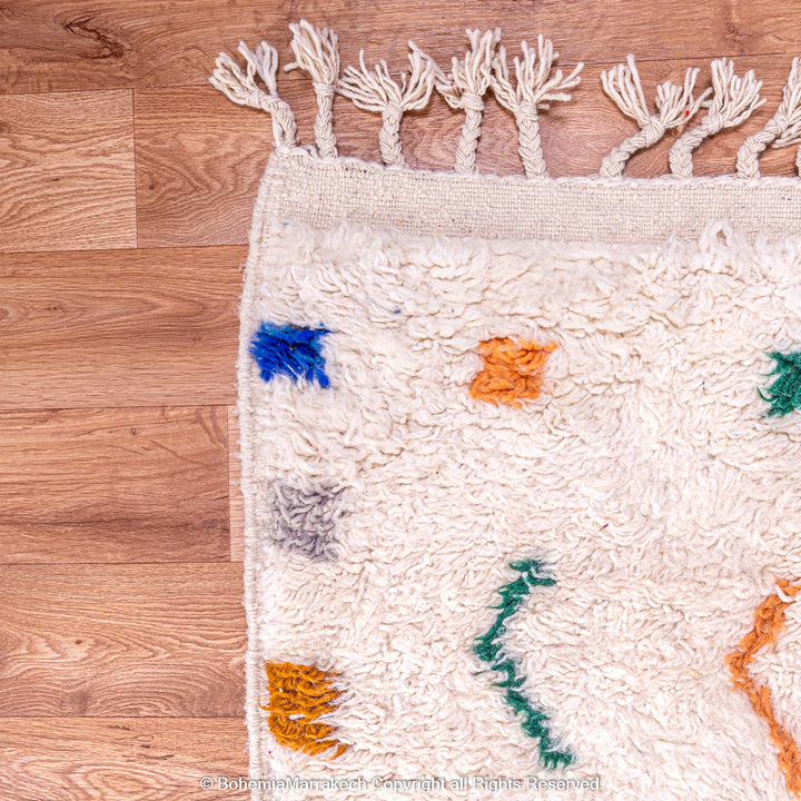 Minimalist Moroccan wool rug with tribal Berber design in natural tones