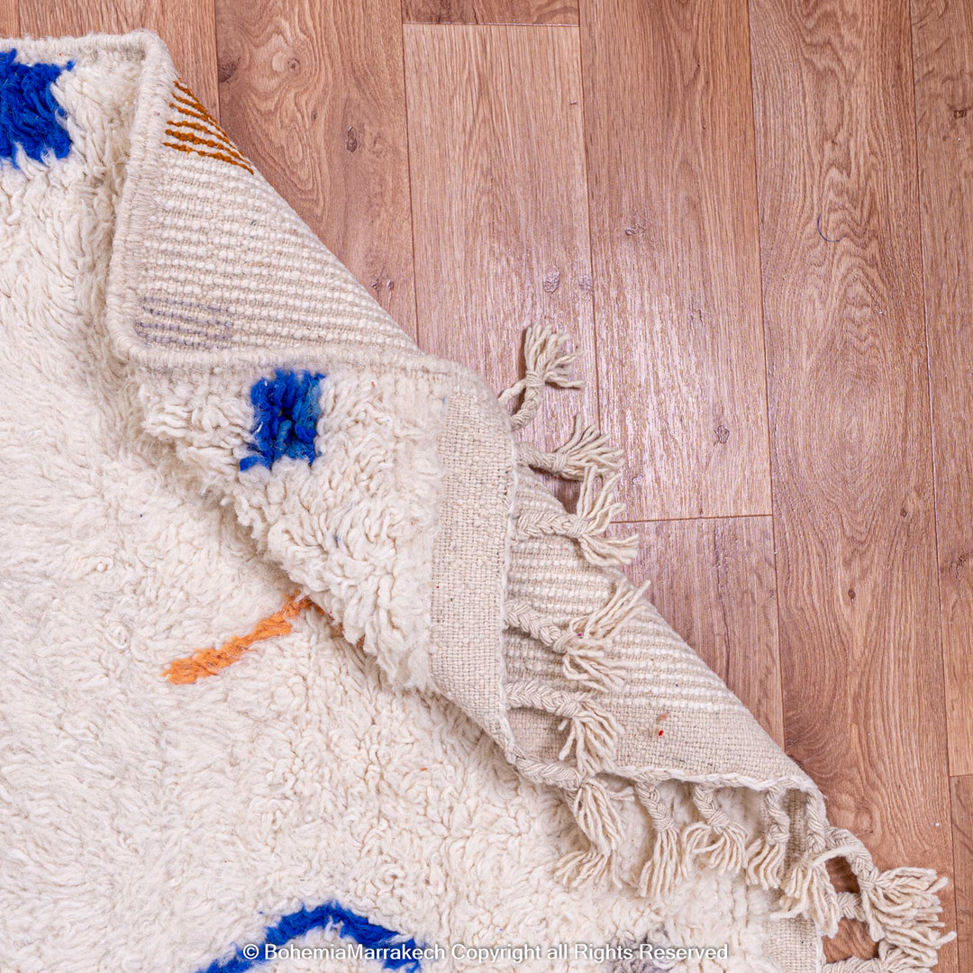 Minimalist Moroccan wool rug with tribal Berber design in natural tones