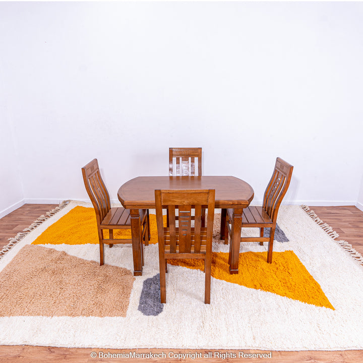 Handmade Moroccan wool rug with abstract orange and beige block design on cream background
