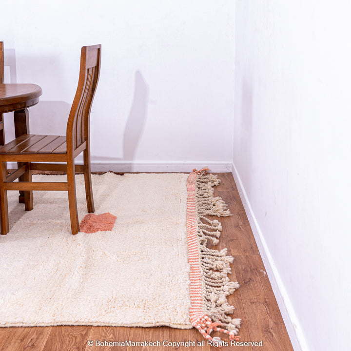 Desert-inspired Moroccan rug with earthy red and brown abstract mountain motifs, handmade from 100% wool