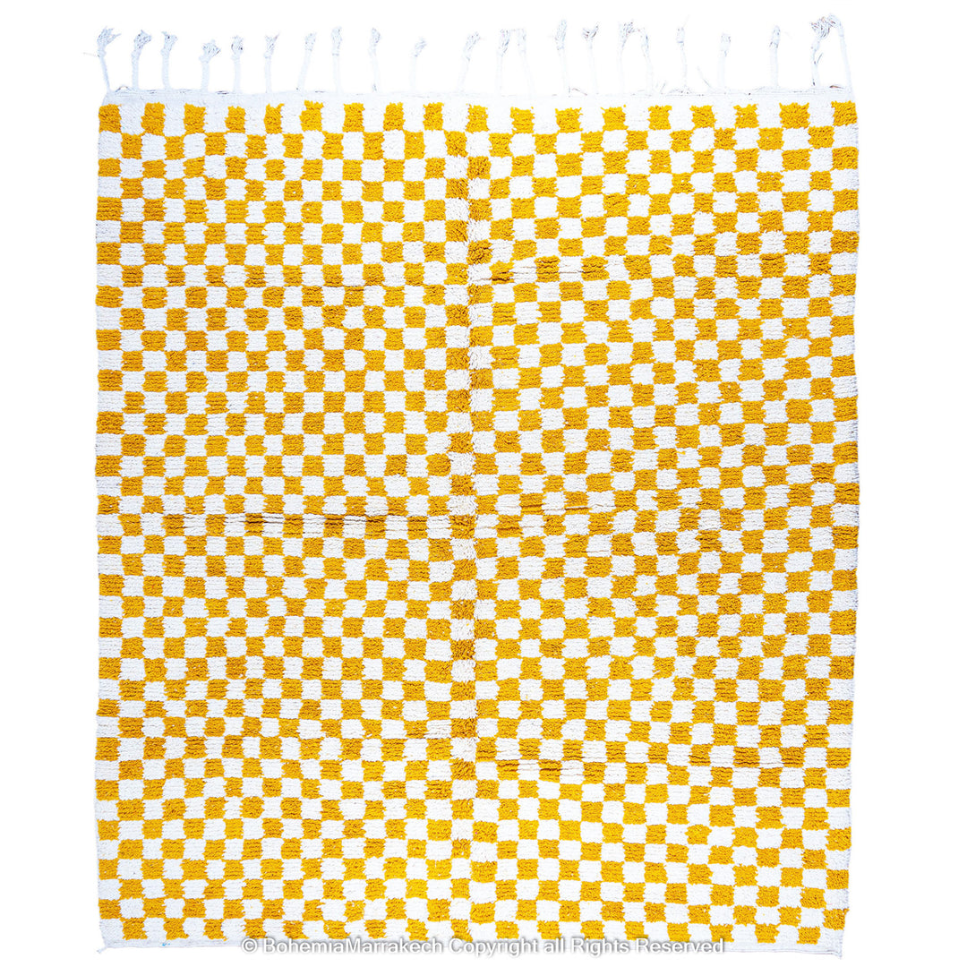 Handwoven Moroccan rug in yellow and white checkerboard pattern, crafted from soft wool