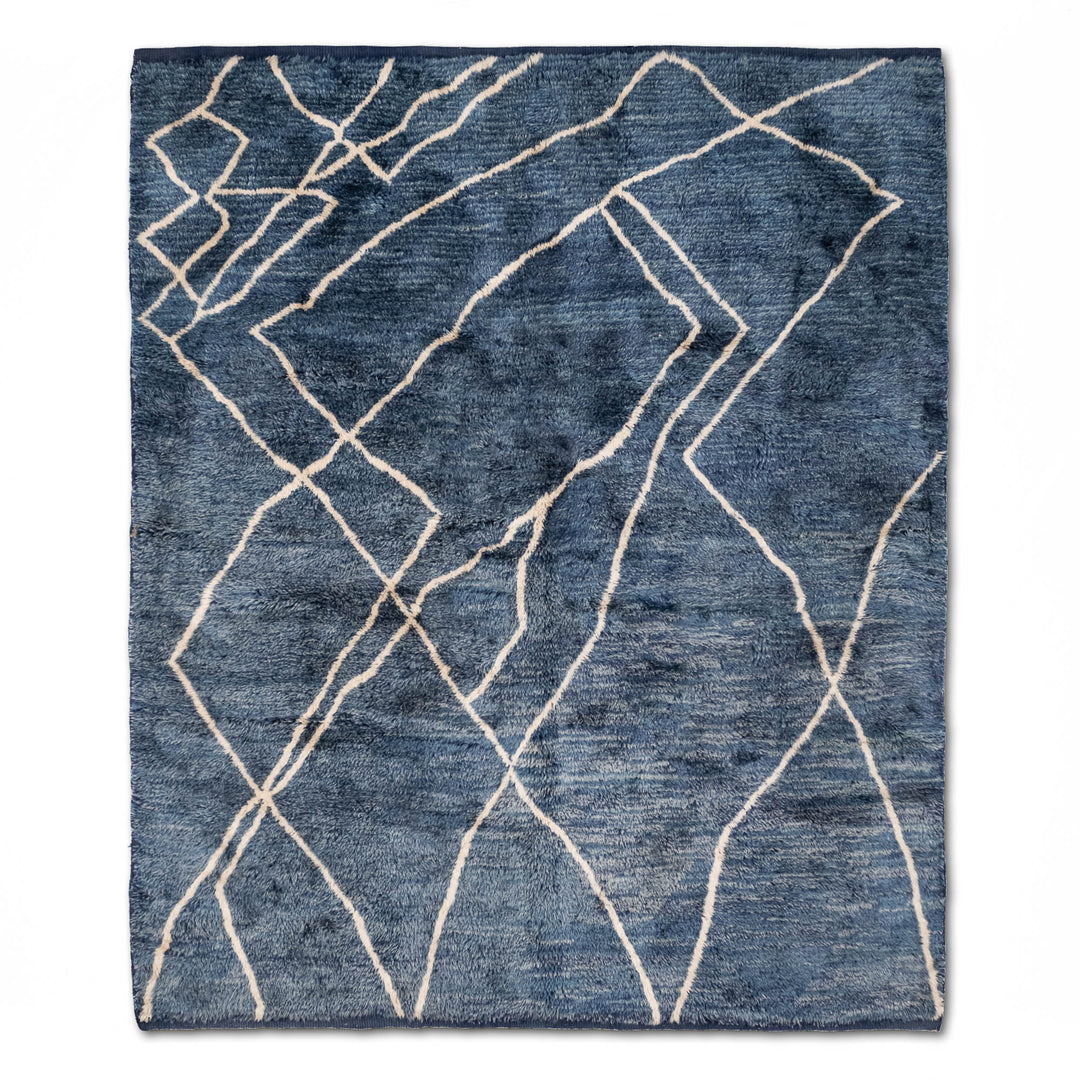 Blue Moroccan Beni Mrirt Rug with ivory geometric lines on denim-blue background. Handwoven wool, elegant Moroccan rug for modern spaces.