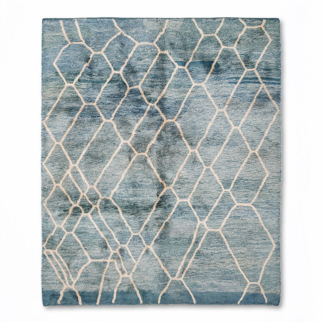 Blue Moroccan wool rug with ivory diamond pattern, handcrafted and ocean-inspired. Perfectly plush, this rug adds style and comfort.