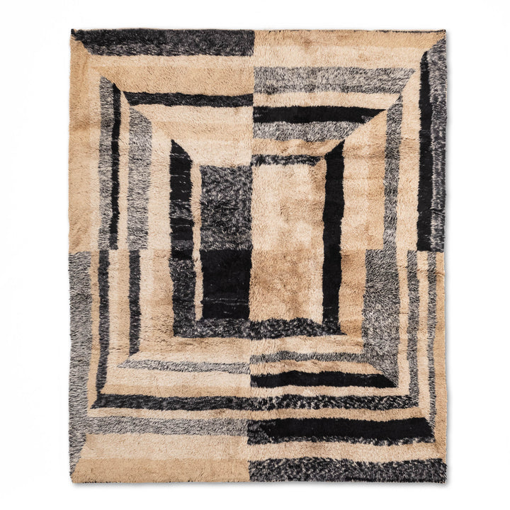 Black and beige geometric Moroccan wool rug with bold patterns, ideal for modern interiors. Handmade Beni Mrirt area rug.