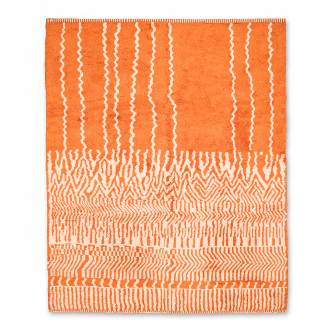 Bold orange Moroccan rug with tribal zigzag pattern, showcasing traditional Berber design. Perfect for eclectic and vibrant interiors.