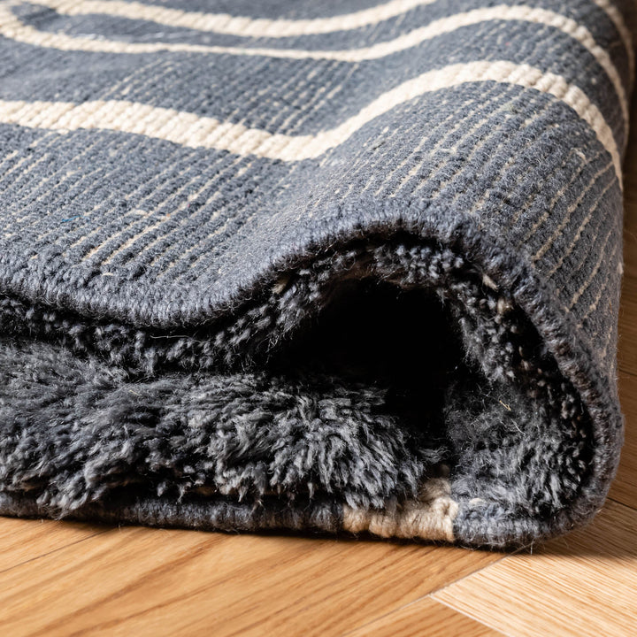Close-up of Charcoal Grey Beni Mrirt Moroccan Wool Rug showcasing texture and craftsmanship.