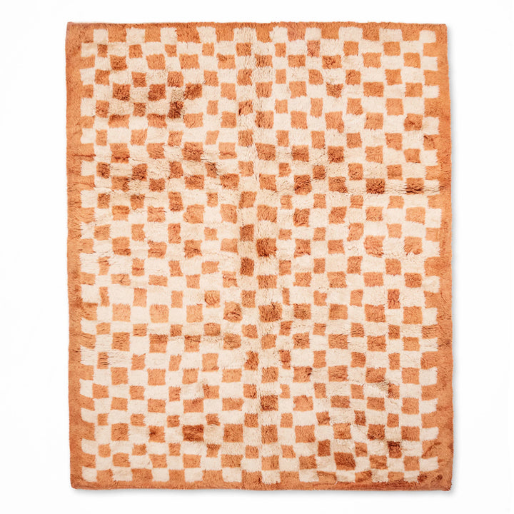 Handmade checkered Moroccan Berber rug with shag finish, ideal as an area rug. Textured wool design, available in various sizes.
