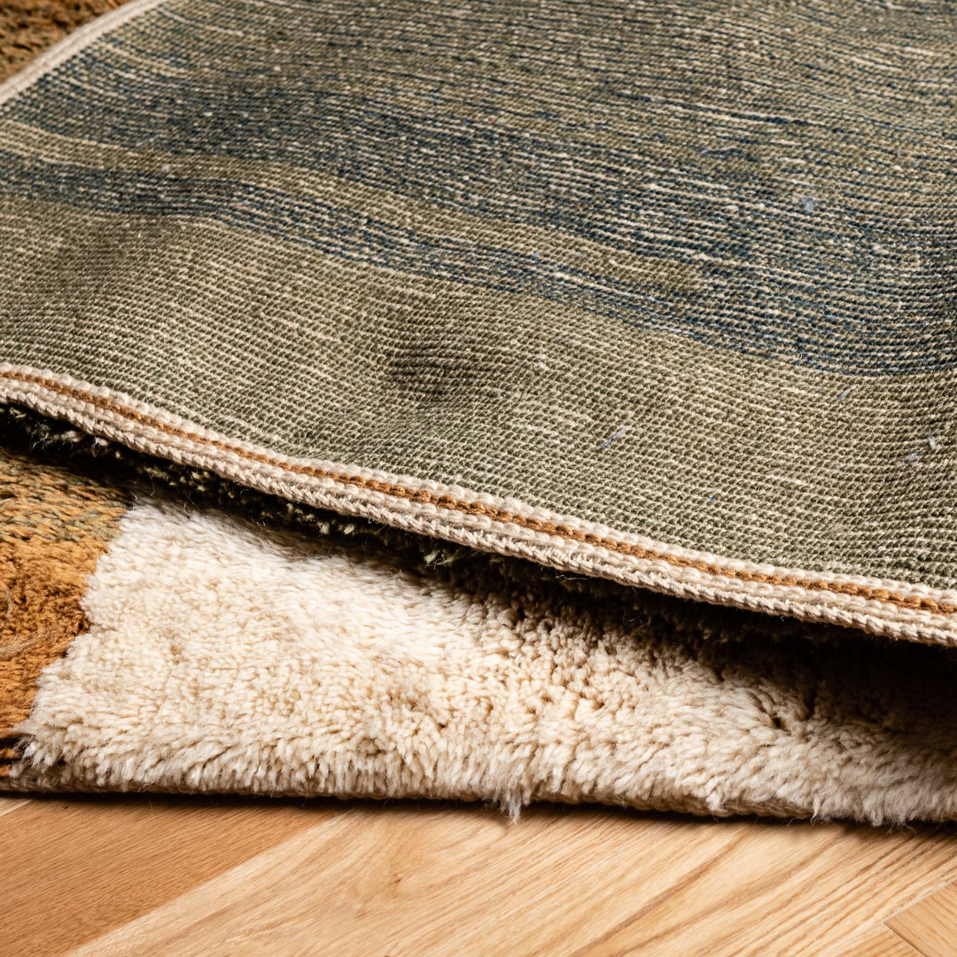 Close-up of handmade Moroccan Beni Mrirt rug showing earthy tones and plush texture. Moroccan wool rug, traditional Moroccan carpet.