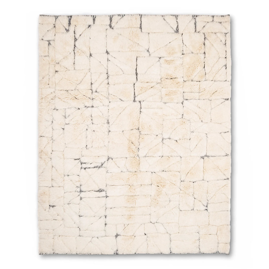 Cream Moroccan wool rug with abstract grid lines, handcrafted by artisans, showcasing traditional Berber motifs. Perfect area rug for sale.