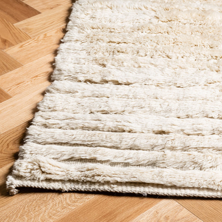 Cream Textured Beni Mrirt Rug with Ribbed Design on Wooden Floor, Moroccan Wool Rug for Modern and Traditional Interiors