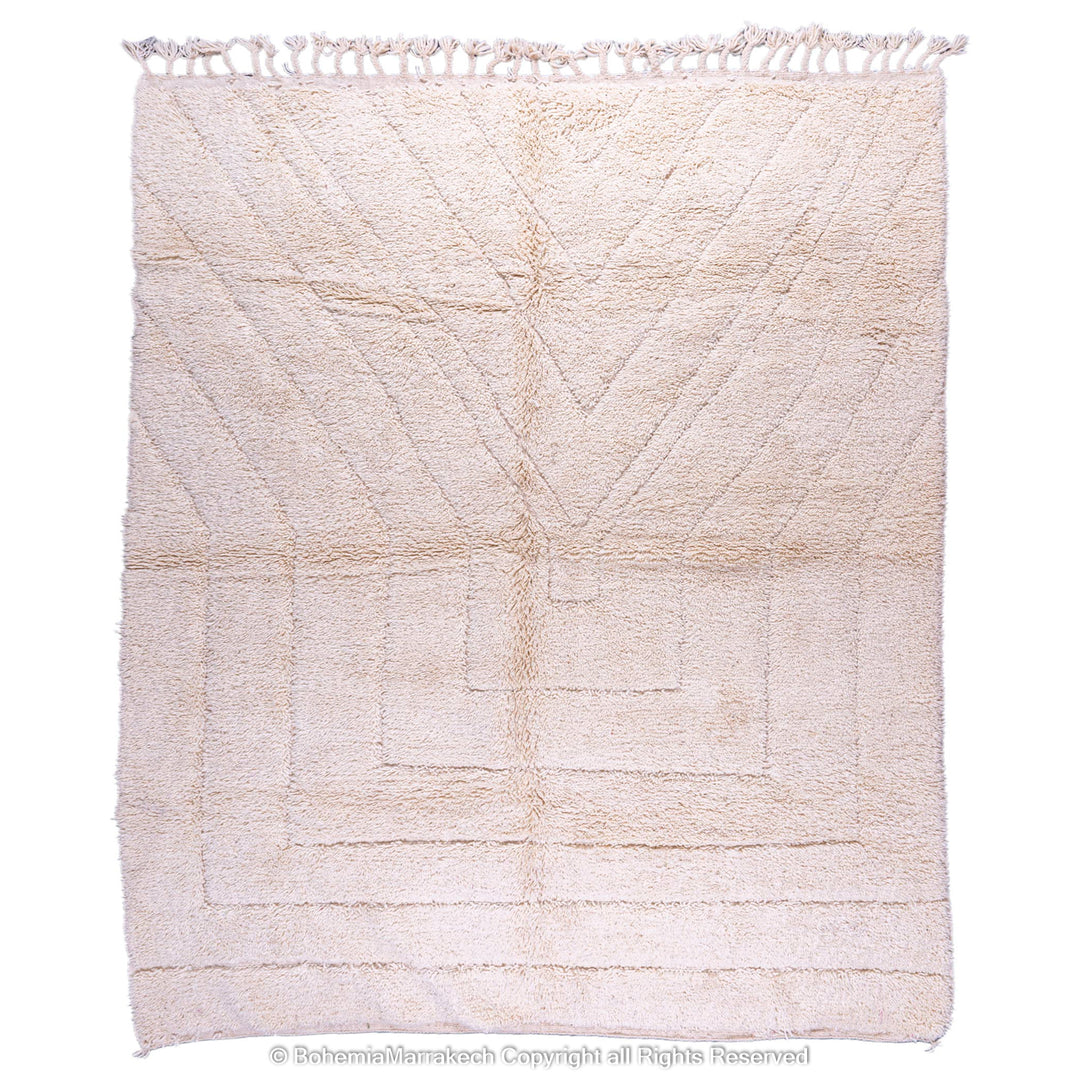 Cream Moroccan Berber wool rug with minimalist geometric pattern, handmade in the Atlas Mountains. Ideal for serene, modern interiors.