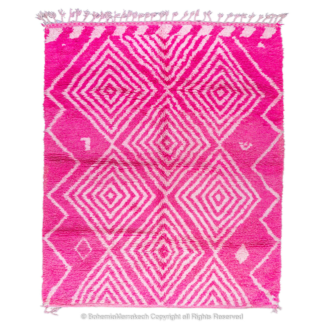 Pink Moroccan Berber diamond motif wool rug with geometric patterns, handmade by artisans, 8x10 size. Vibrant and cozy.