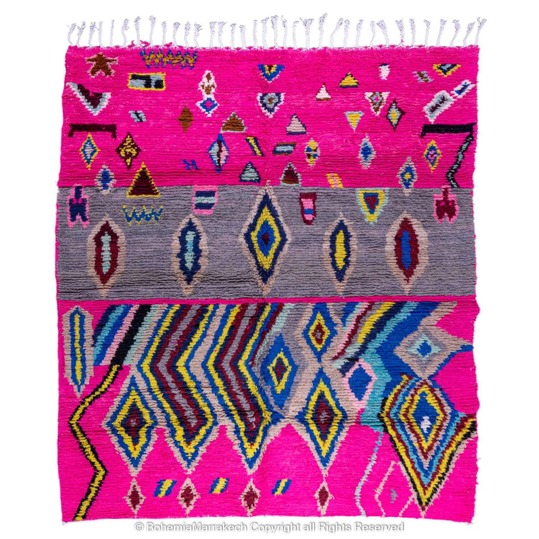 Pink Moroccan Berber rug with vibrant geometric patterns and multicolor design.