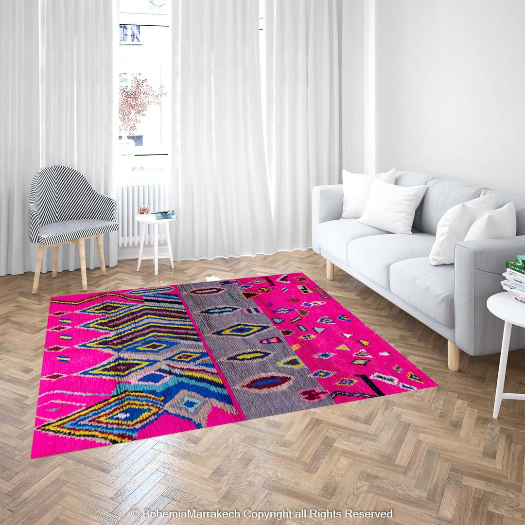 Bold pink Moroccan rug with multicolor Berber motifs in a modern living room. Ideal for adding vibrant energy and style.