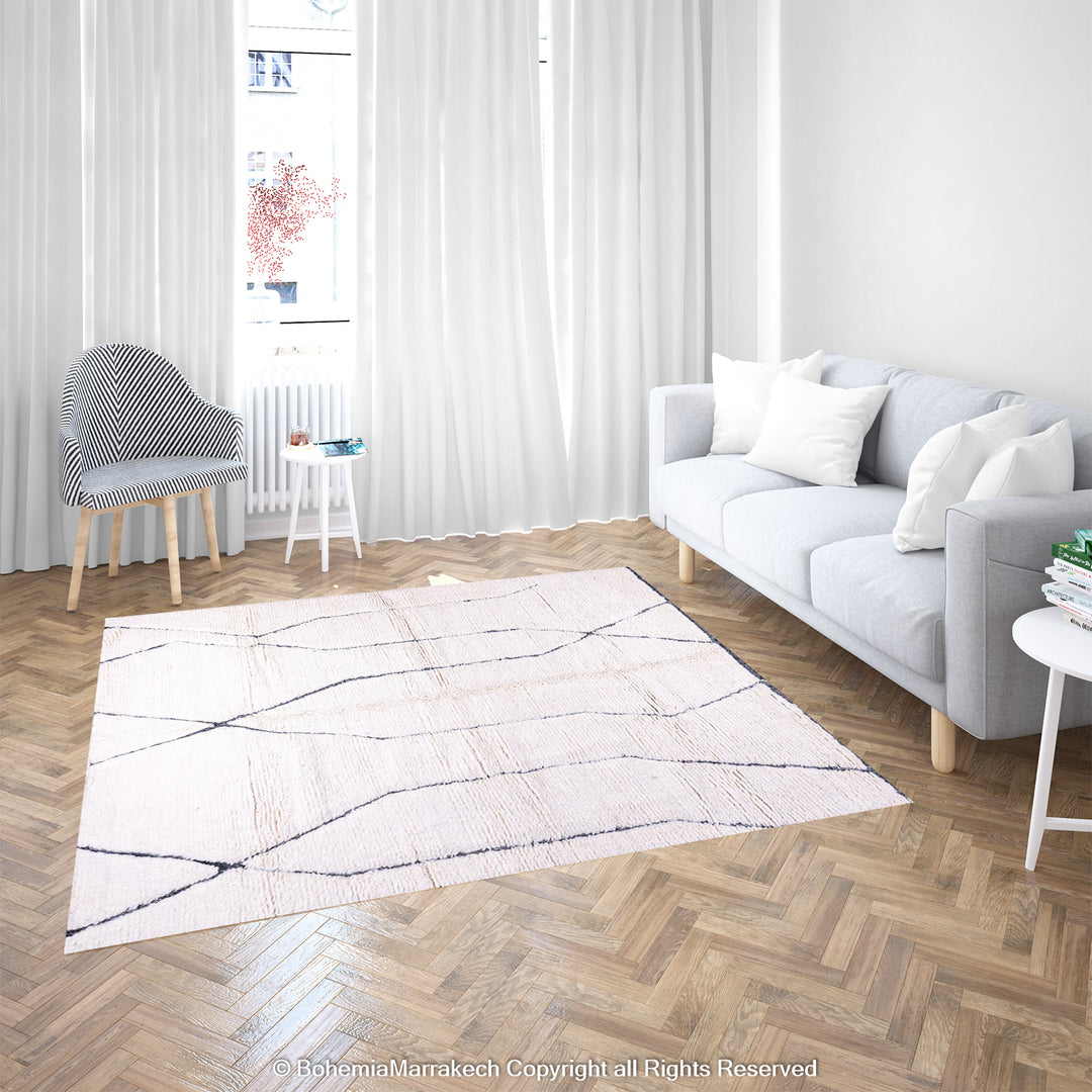 White Moroccan Beni Ourain wool rug with black lines in a modern living room, ideal for Moroccan interiors.