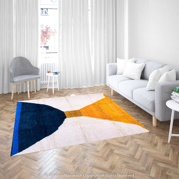 Modern Moroccan wool rug with yellow, navy abstract hourglass design in a stylish living room. Perfect Moroccan wool rug for sale.