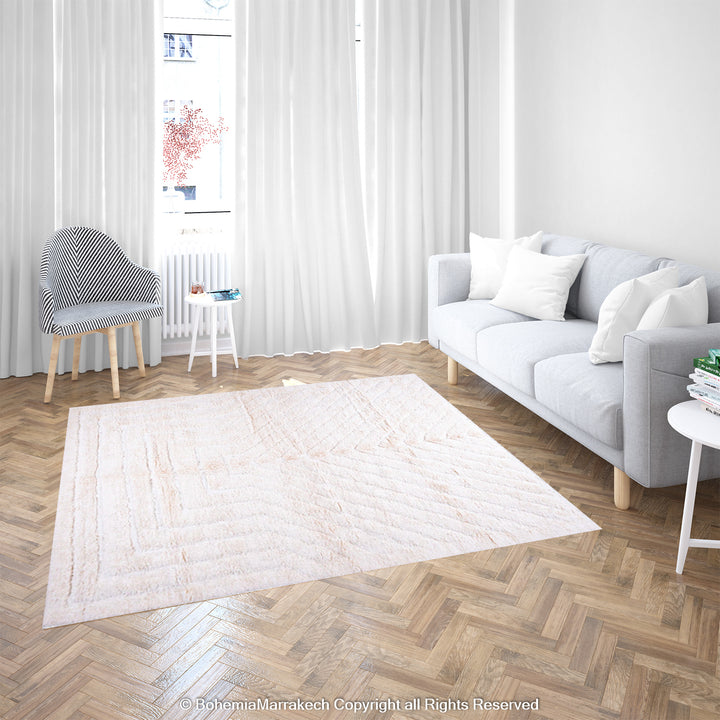 White Moroccan rug with subtle V-line texture in a modern minimalist living room setting.