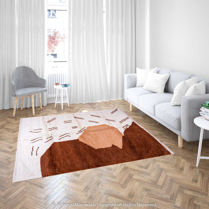 Modern Moroccan rug with abstract brown and beige design in a bright living room setting.