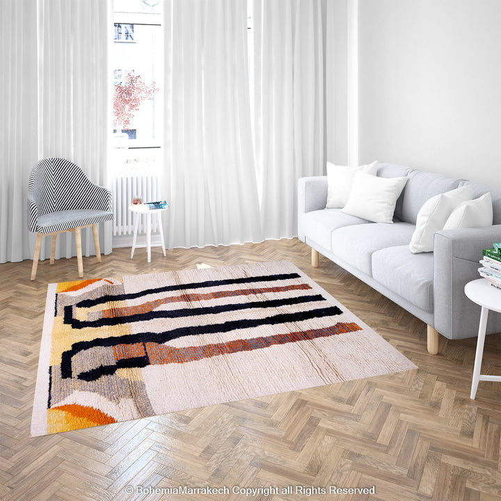 Striped Abstract Moroccan Berber Rug with bold black, orange stripes on a creamy base in a modern living room.