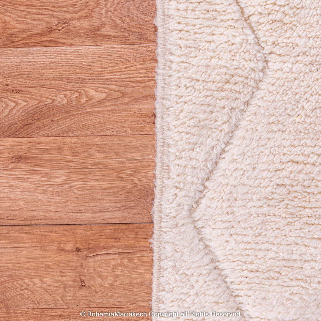White Moroccan Rug with Zigzag Design on Wooden Floor - Moroccan Wool Rug