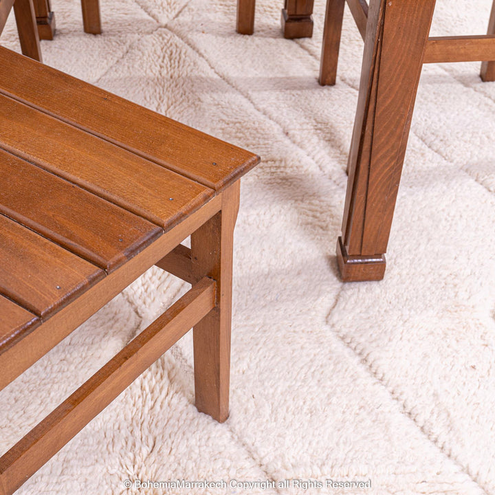 White Moroccan Rug with Zigzag Design Under Wooden Furniture