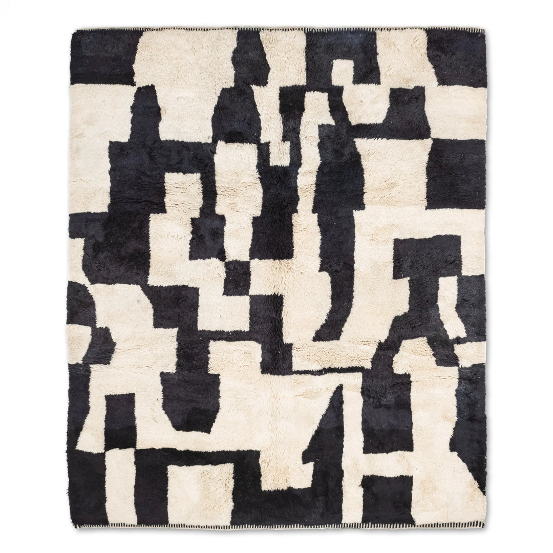 Custom Beni Mrirt rug with abstract black and cream pattern, handwoven Moroccan wool rug, modern geometric design.